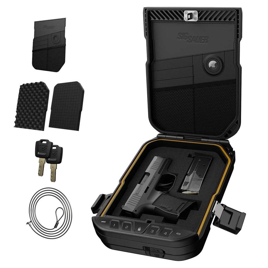 Open biometric travel safe with foam interior, handgun, magazine, backup keys, and security cable