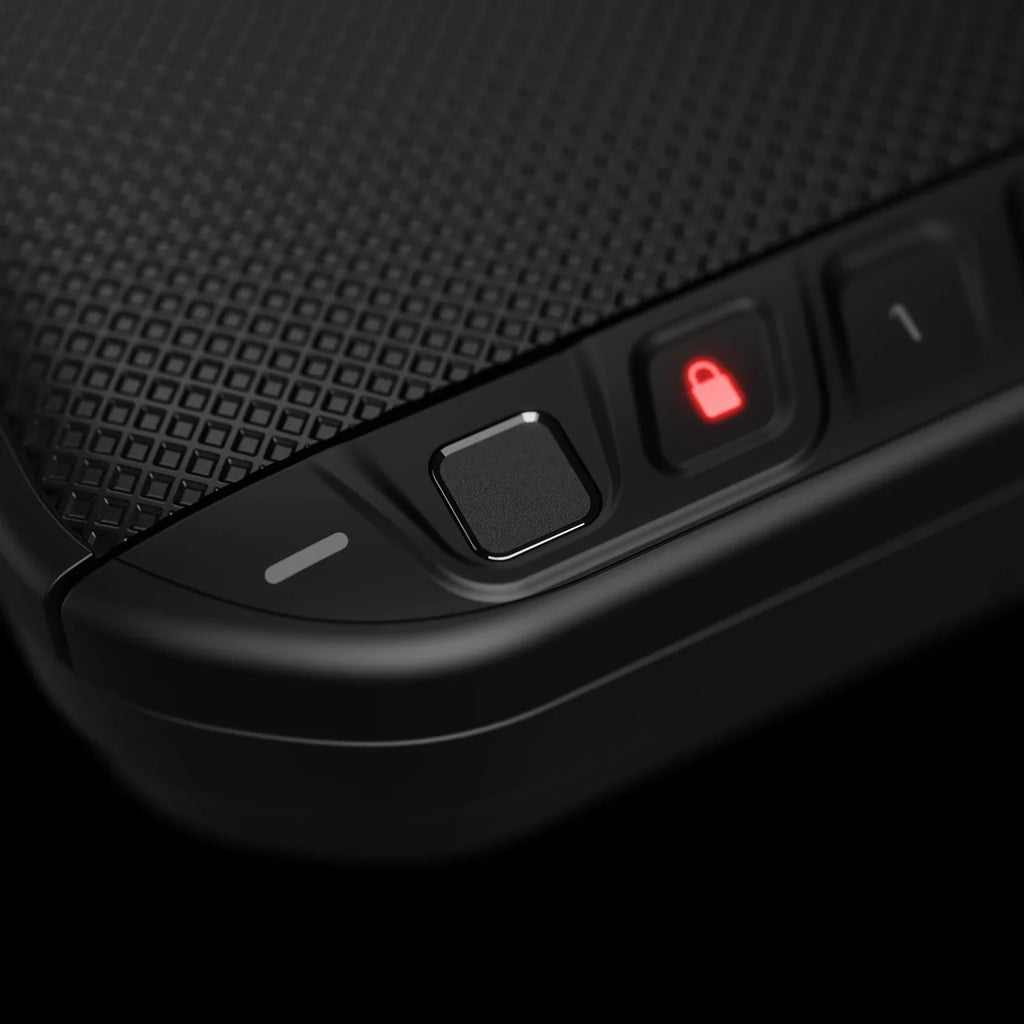 Close-up of biometric lock interface on textured portable safe with illuminated lock icon