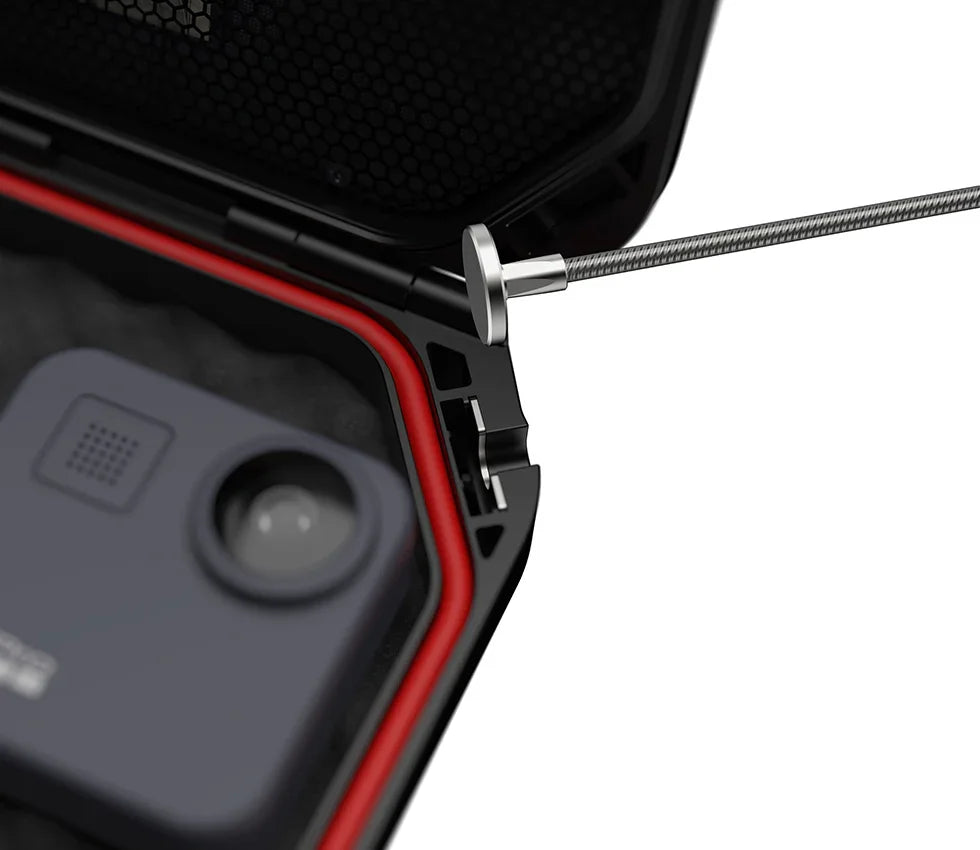 Closeup of portable biometric safe interior with steel security cable and red seal