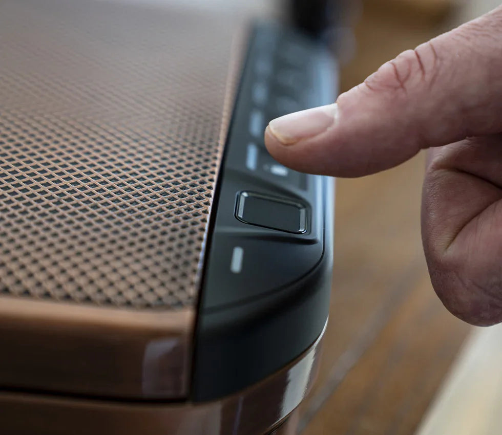 Hand using fingerprint scanner on biometric safe with metal textured surface