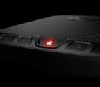 Closeup of keypad and illuminated red lock icon on black biometric safe