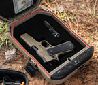 Outdoor biometric safe with foam interior holding a handgun and flashlight