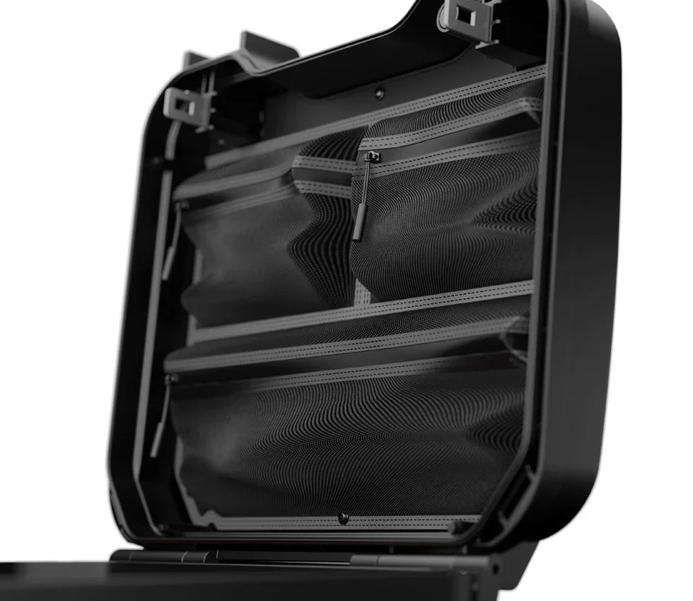 Open security safe interior with mesh zippered organizer pockets and black case design