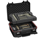 Open portable safe with foam inserts, storing a handgun, magazines, knife, and accessories.