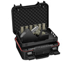 Open portable gun safe with foam lining, handgun, and magazines organized inside.
