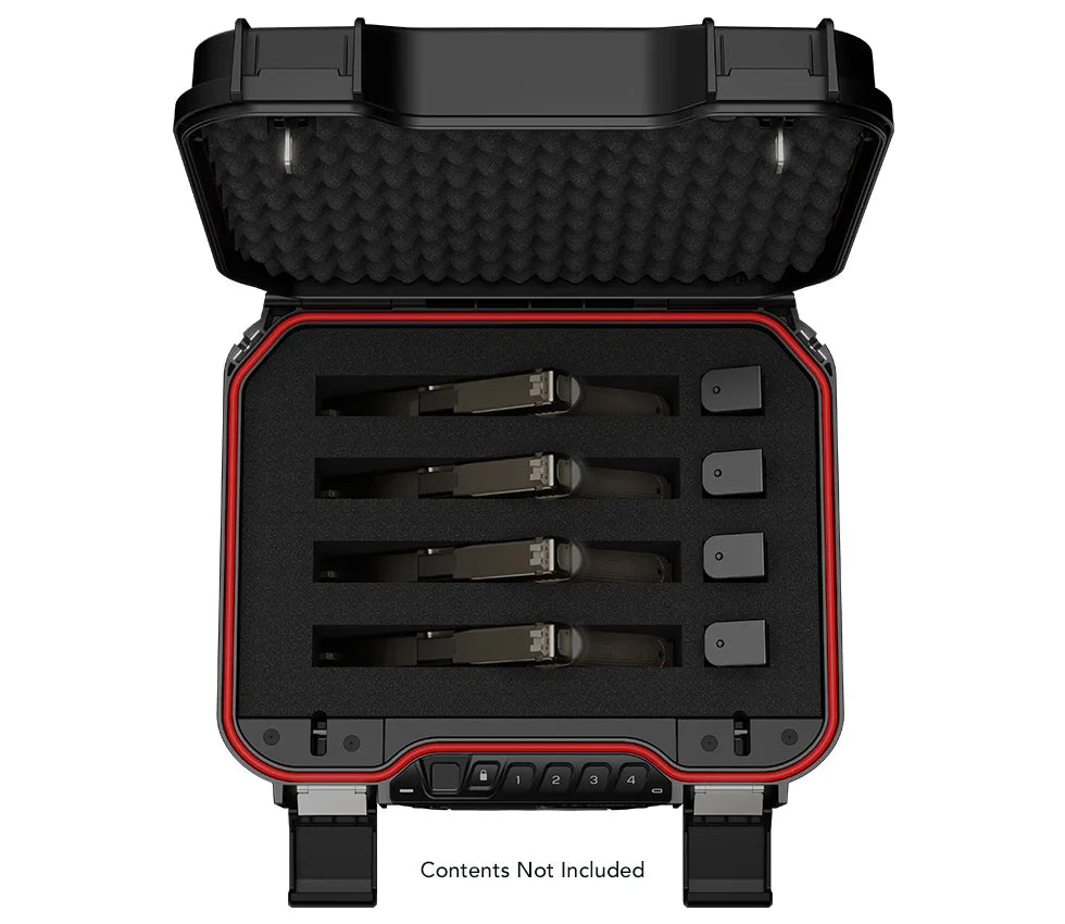Open biometric safe with foam interior, showing storage slots for four magazines.