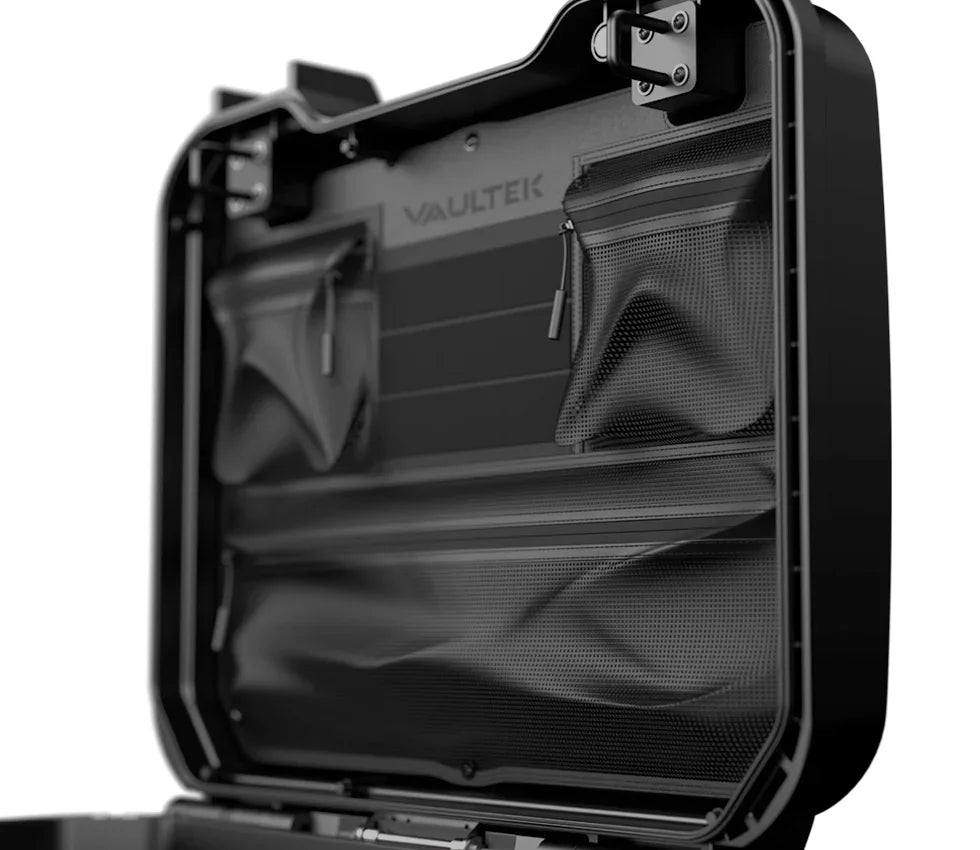 Open black security safe with interior zippered mesh pockets on the lid