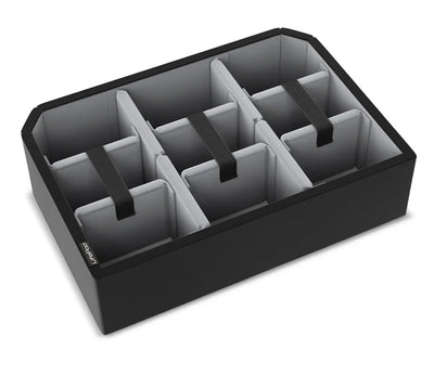 Black safe storage organizer tray with six padded compartments and pull straps.