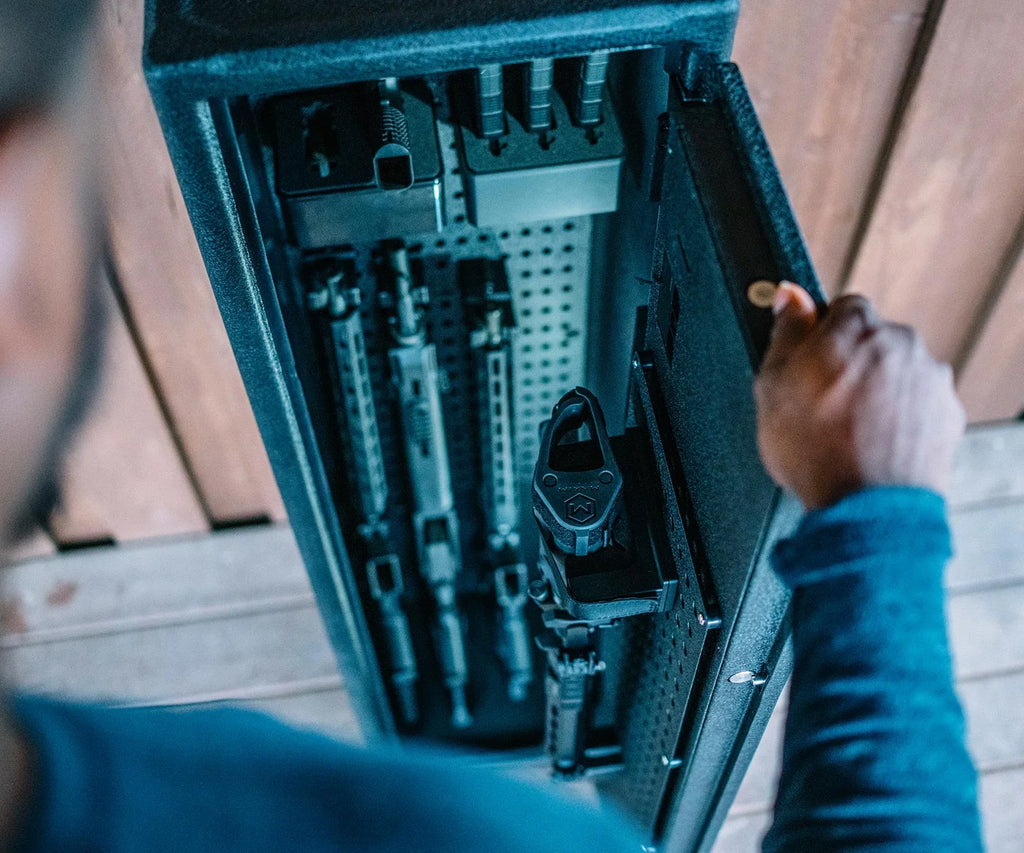 Person opening biometric rifle safe with multiple firearms and secure storage compartments