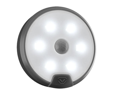 Round LED motion sensor light with black trim, illuminated, for safe interiors